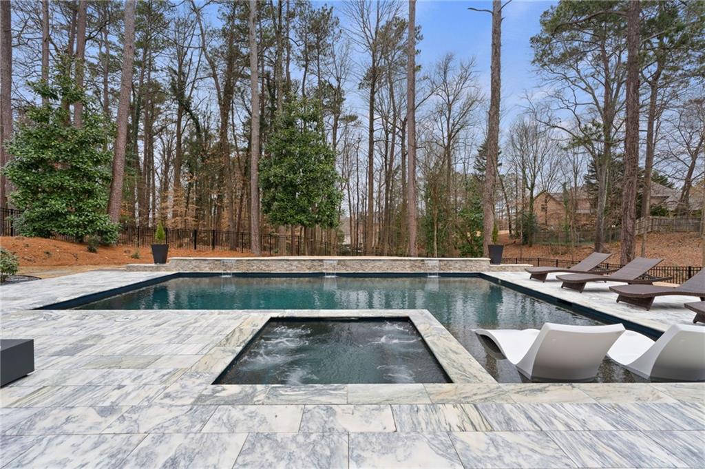 4226 South Berkeley Lake Road Northwest Berkeley Lake, GA 30096 - Photo 41 of 61 a view of swimming pool with chairs