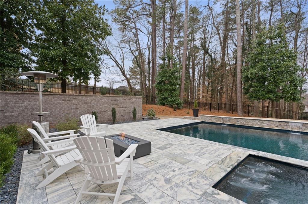 4226 South Berkeley Lake Road Northwest Berkeley Lake, GA 30096 - Photo 42 of 61 a view of backyard with swimming pool and patio