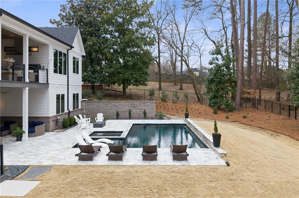4226 South Berkeley Lake Road Northwest Berkeley Lake, GA 30096 - Photo 43 of 61 a view of a house with backyard and sitting area