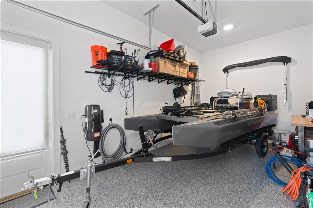 4226 South Berkeley Lake Road Northwest Berkeley Lake, GA 30096 - Photo 46 of 61 a room with gym equipment and windows