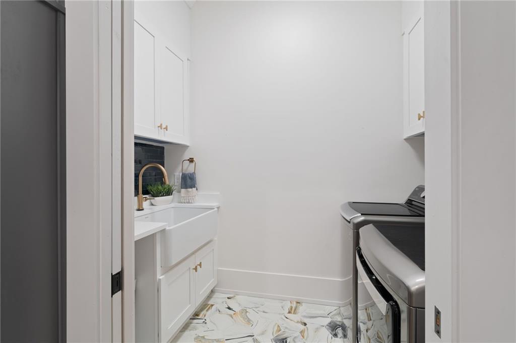 4226 South Berkeley Lake Road Northwest Berkeley Lake, GA 30096 - Photo 48 of 61 a bathroom with a sink a toilet and shower