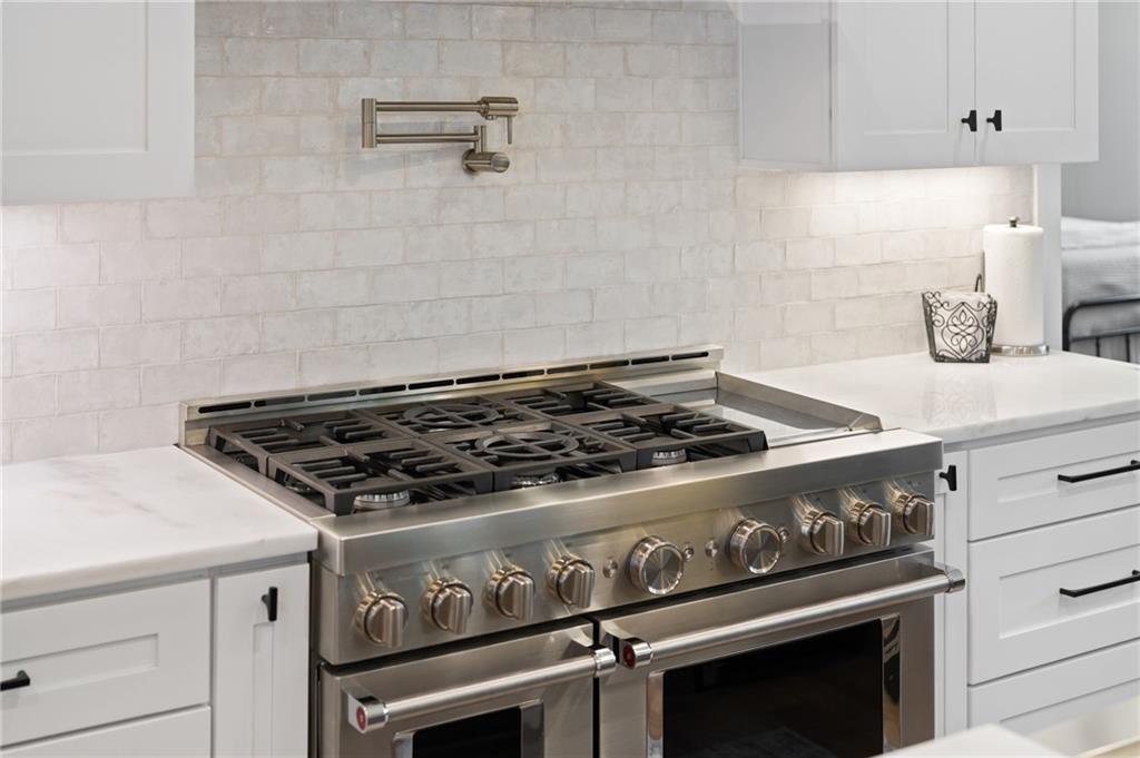 4226 South Berkeley Lake Road Northwest Berkeley Lake, GA 30096 - Photo 51 of 61 a stove top oven sitting inside of a kitchen