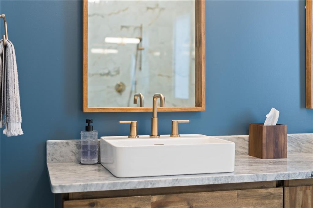 4226 South Berkeley Lake Road Northwest Berkeley Lake, GA 30096 - Photo 52 of 61 a bathroom with a granite countertop sink and a mirror
