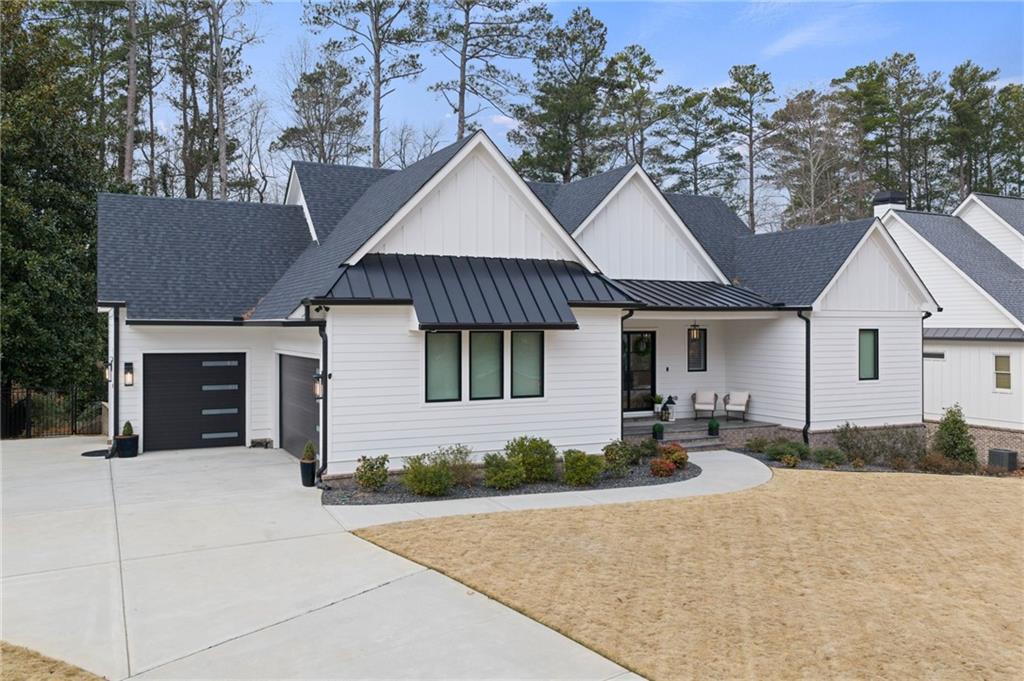 4226 South Berkeley Lake Road Northwest Berkeley Lake, GA 30096 - Photo 57 of 61 a front view of a house with yard