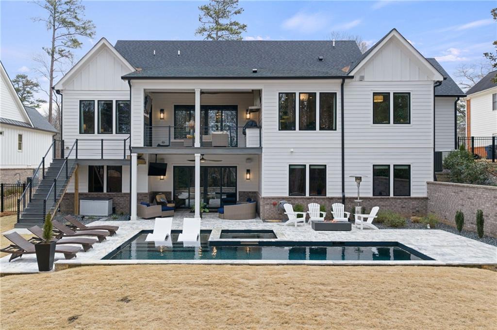 4226 South Berkeley Lake Road Northwest Berkeley Lake, GA 30096 - Photo 59 of 61 a front view of a house with glass windows and a sink