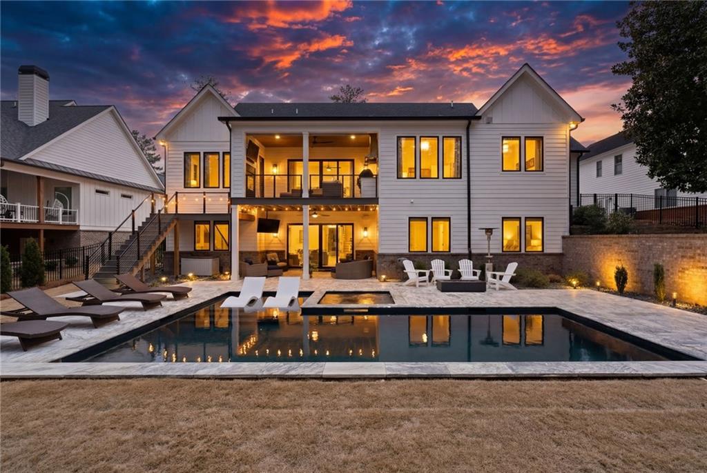 4226 South Berkeley Lake Road Northwest Berkeley Lake, GA 30096 - Photo 61 of 61 a front view of residential houses with cars parked