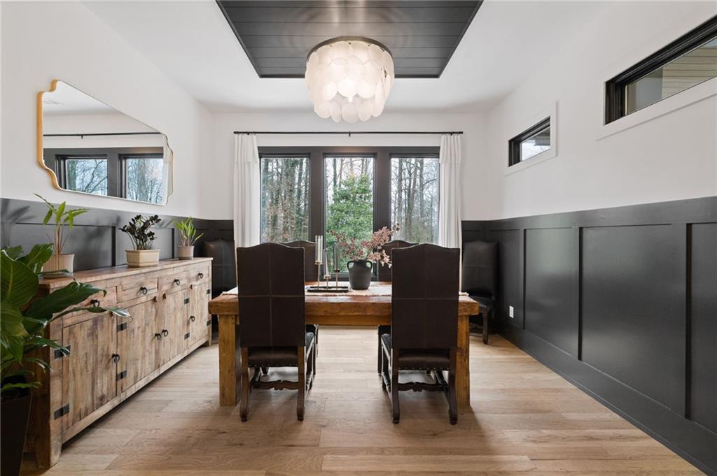 4226 South Berkeley Lake Road Northwest Berkeley Lake, GA 30096 - Photo 7 of 61 a view of a dining room with furniture window and wooden floor