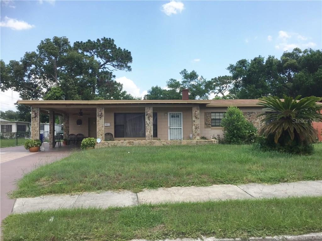 5727 Lawndale Road Orlando, FL 32808 - Photo 1 of 1 a view of a house with a yard and a garden