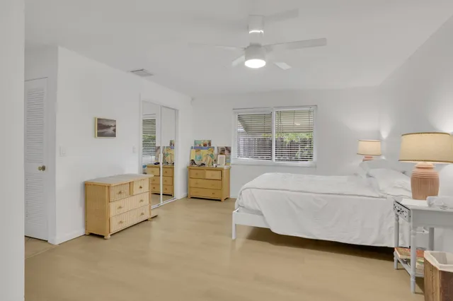 a bed room with a bed and a lamp