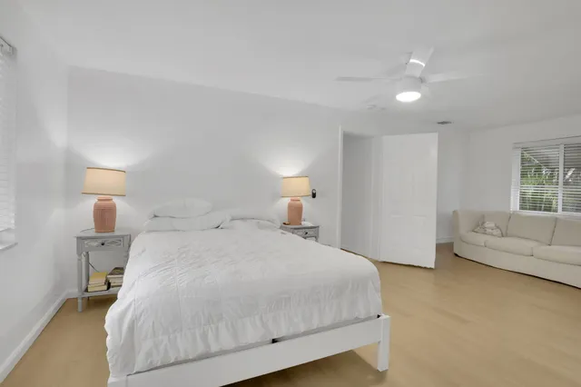 a bedroom with a bed and a couch