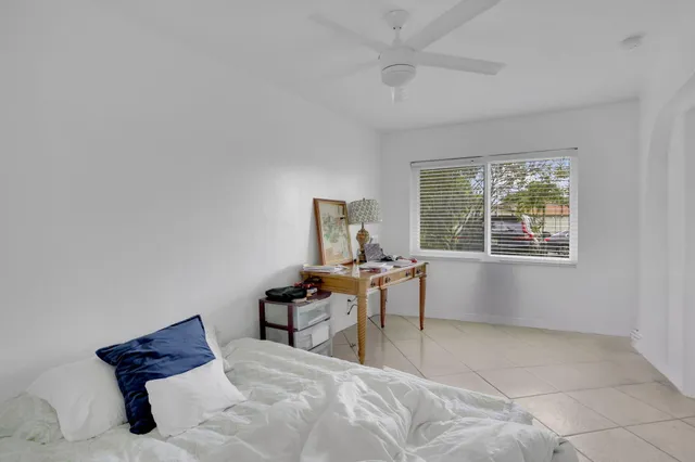 a work room with furniture and a window