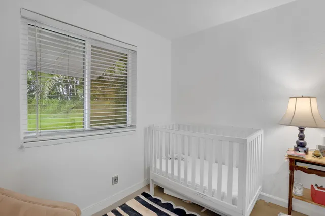 a room with a window and a bedroom