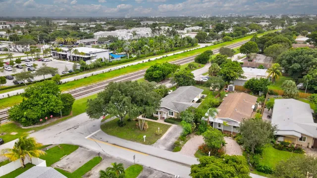 an aerial view of residential houses with outdoor space