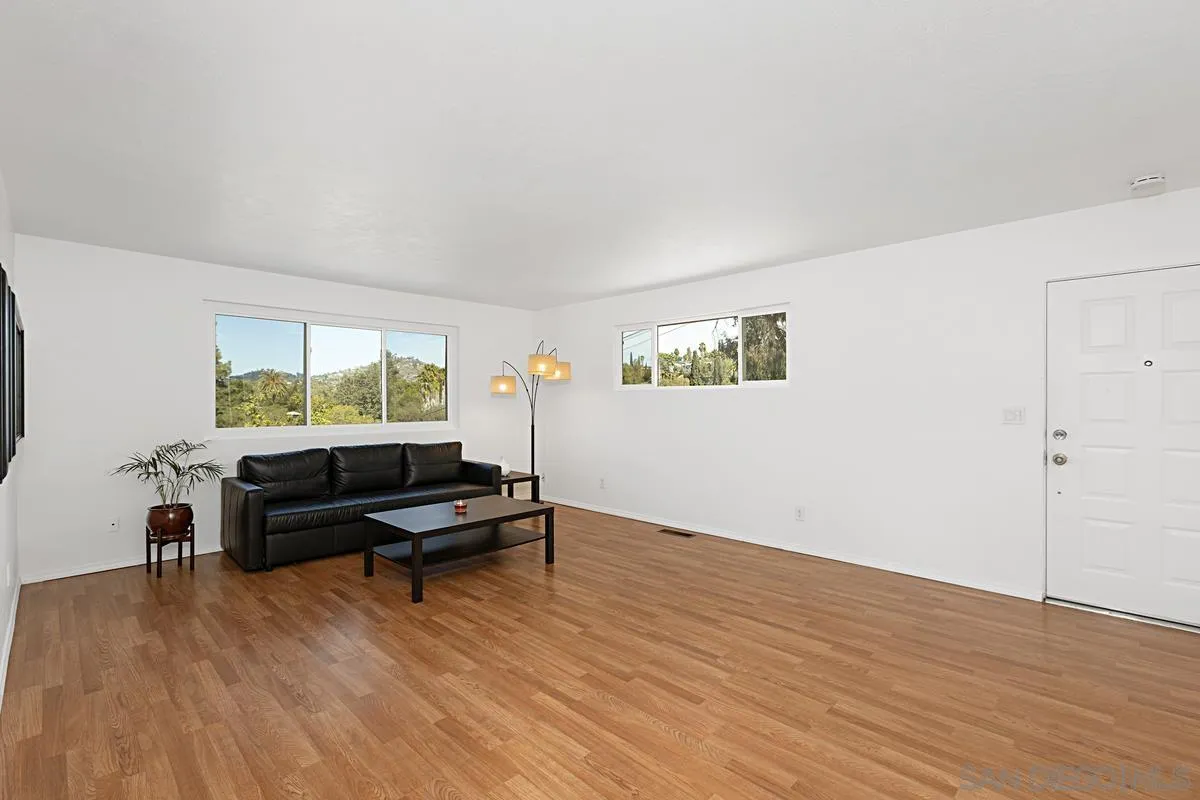 9147 Rosedale Drive Spring Valley, CA 91977 - Photo 6 of 44 a living room with furniture and a wooden floor