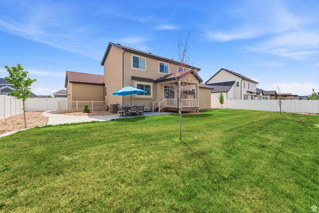1434 West Stable Street Lindon, UT 84042 - Photo 50 of 76 Back of house with stucco siding, a fenced backyard, a patio, and a deck
