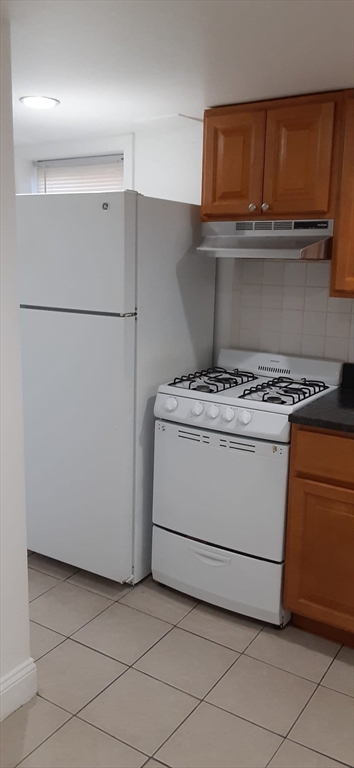 104 Beacon Street, Unit 1 Chelsea, MA 02150 - Photo 2 of 12 a utility room with washer and dryer