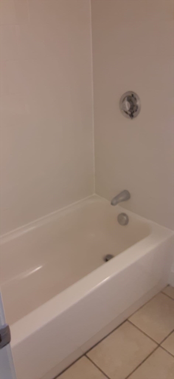 104 Beacon Street, Unit 1 Chelsea, MA 02150 - Photo 7 of 12 a bathroom with a bathtub