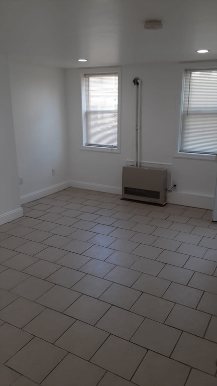 104 Beacon Street, Unit 1 Chelsea, MA 02150 - Photo 9 of 12 an empty room with windows