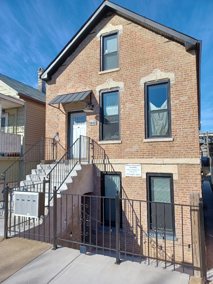 2030 West 21st Street Chicago, IL 60608 - Photo 1 of 19 a front view of a house with a yard