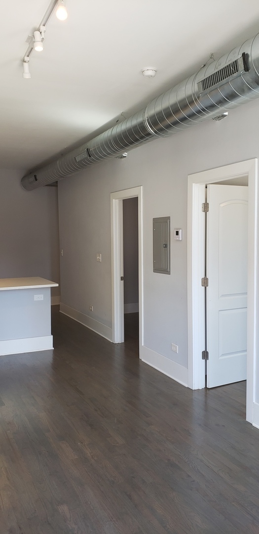 2030 West 21st Street Chicago, IL 60608 - Photo 4 of 19 wooden floor in an empty room