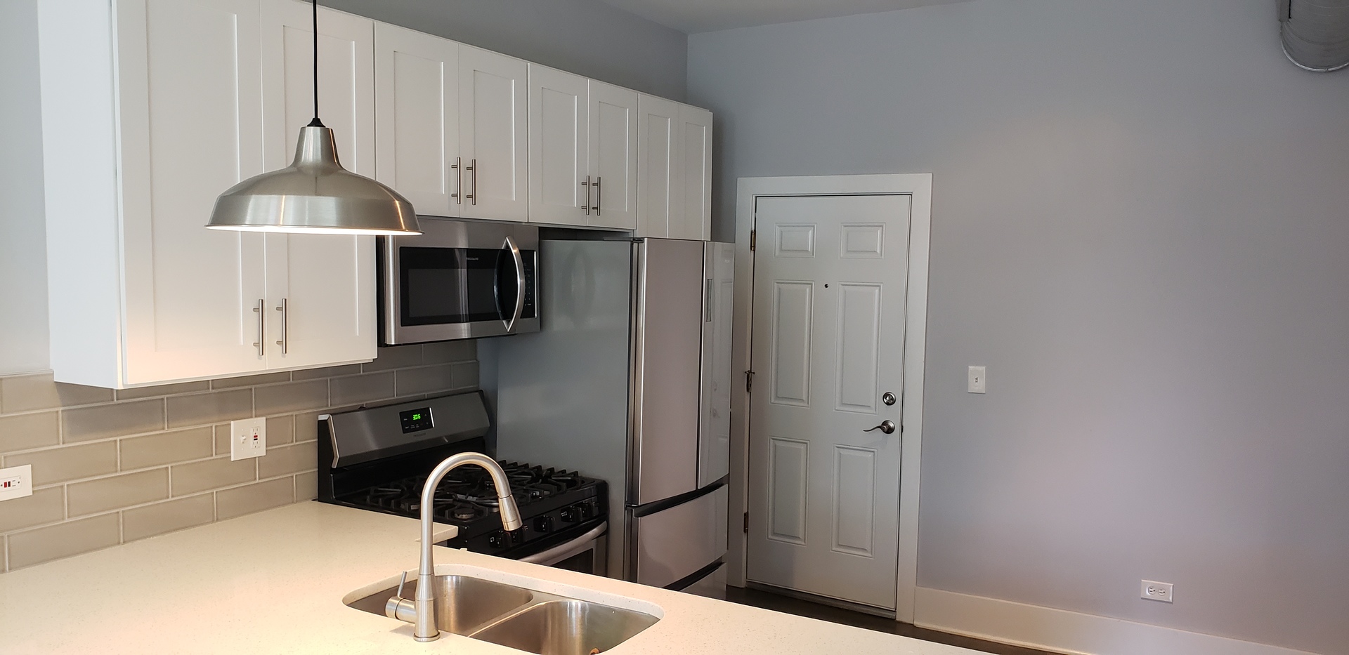 2030 West 21st Street Chicago, IL 60608 - Photo 7 of 19 a close view of a sink and dishwasher in the kitchen