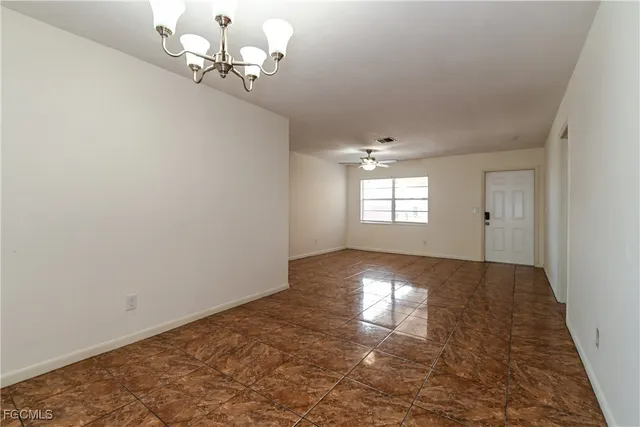 a view of an empty room and window
