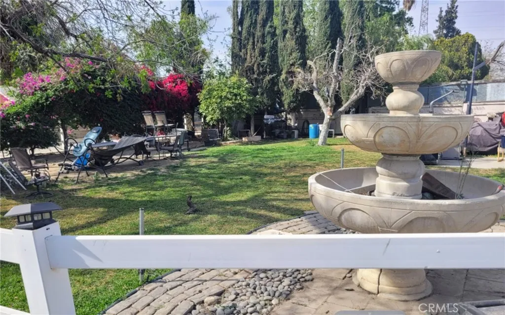 5258 El Rivino Road Jurupa Valley, CA 92509 - Photo 4 of 4 a view of a house with backyard fountain and sitting area