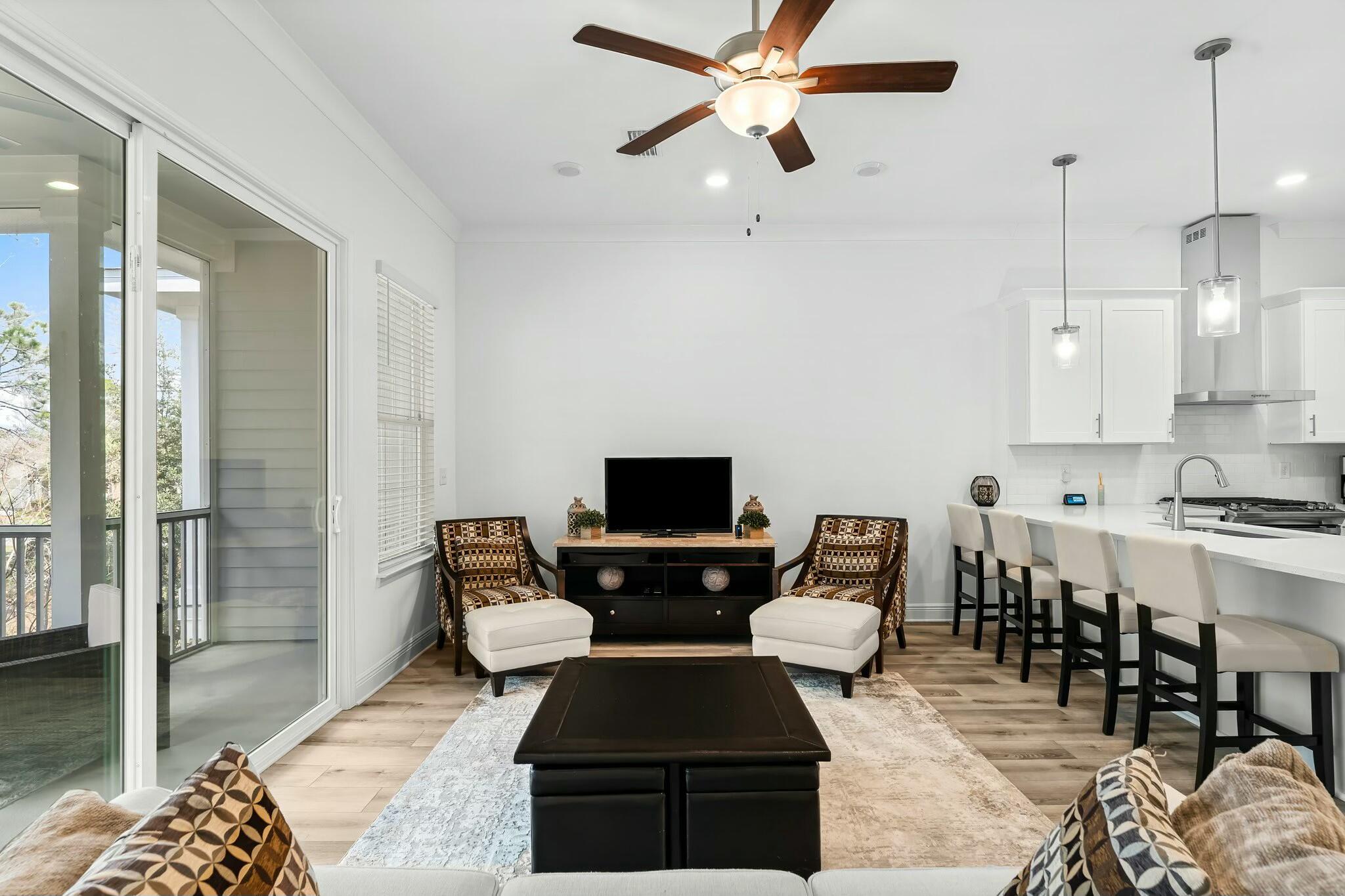 22 Kara Lake Drive Santa Rosa Beach, FL 32459 - Photo 14 of 44 a living room with furniture and a chandelier