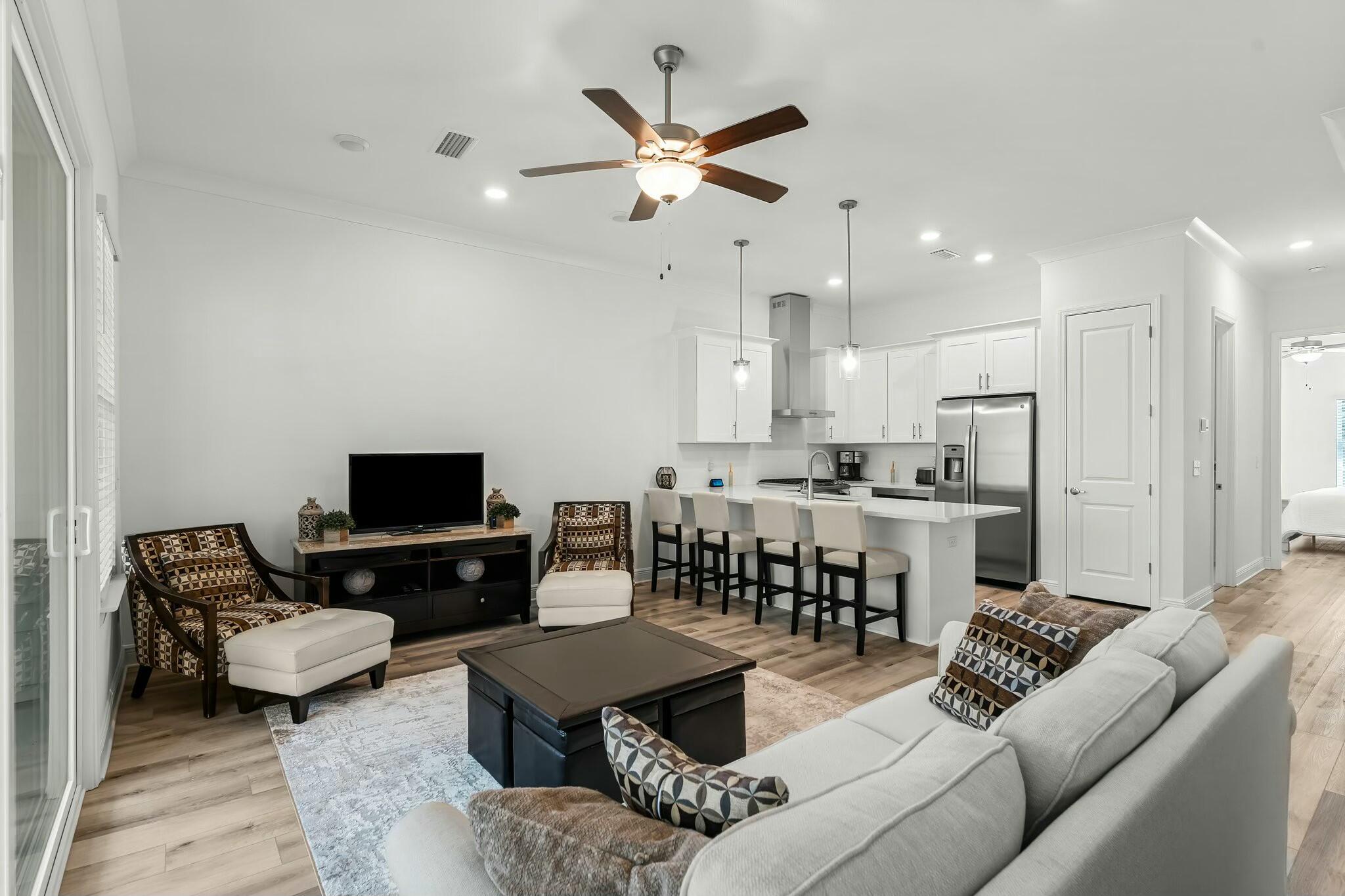 22 Kara Lake Drive Santa Rosa Beach, FL 32459 - Photo 15 of 44 a living room with furniture kitchen view and a chandelier