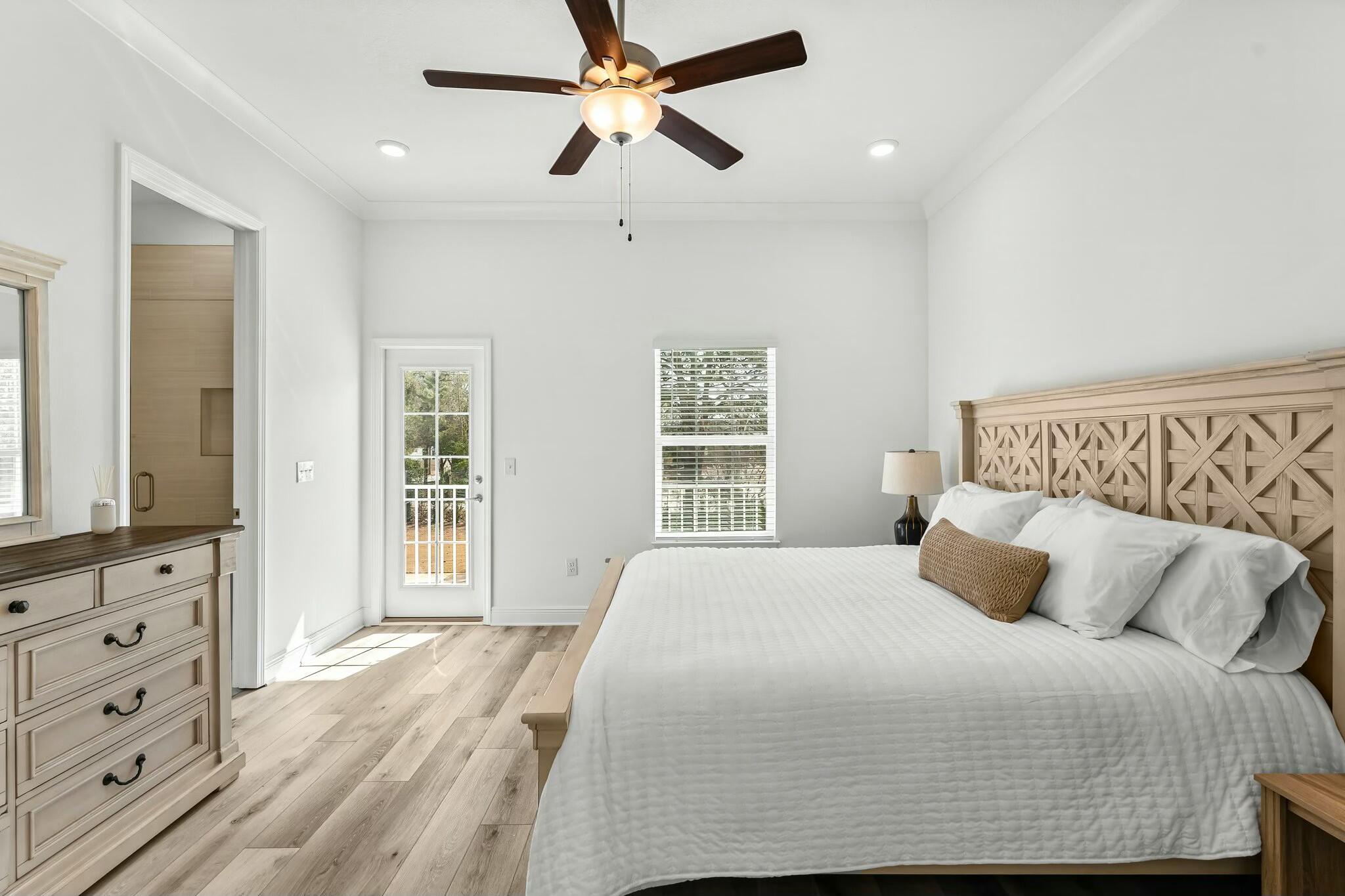 22 Kara Lake Drive Santa Rosa Beach, FL 32459 - Photo 22 of 44 a bedroom with a large bed and a flat tv screen