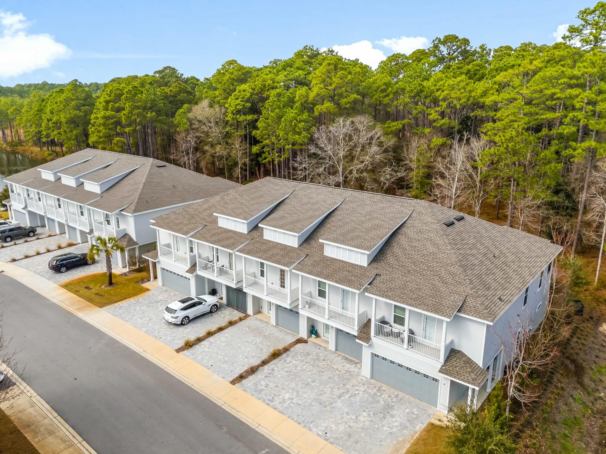 22 Kara Lake Drive Santa Rosa Beach, FL 32459 - Photo 38 of 44 a view of a house with roof deck and sitting area