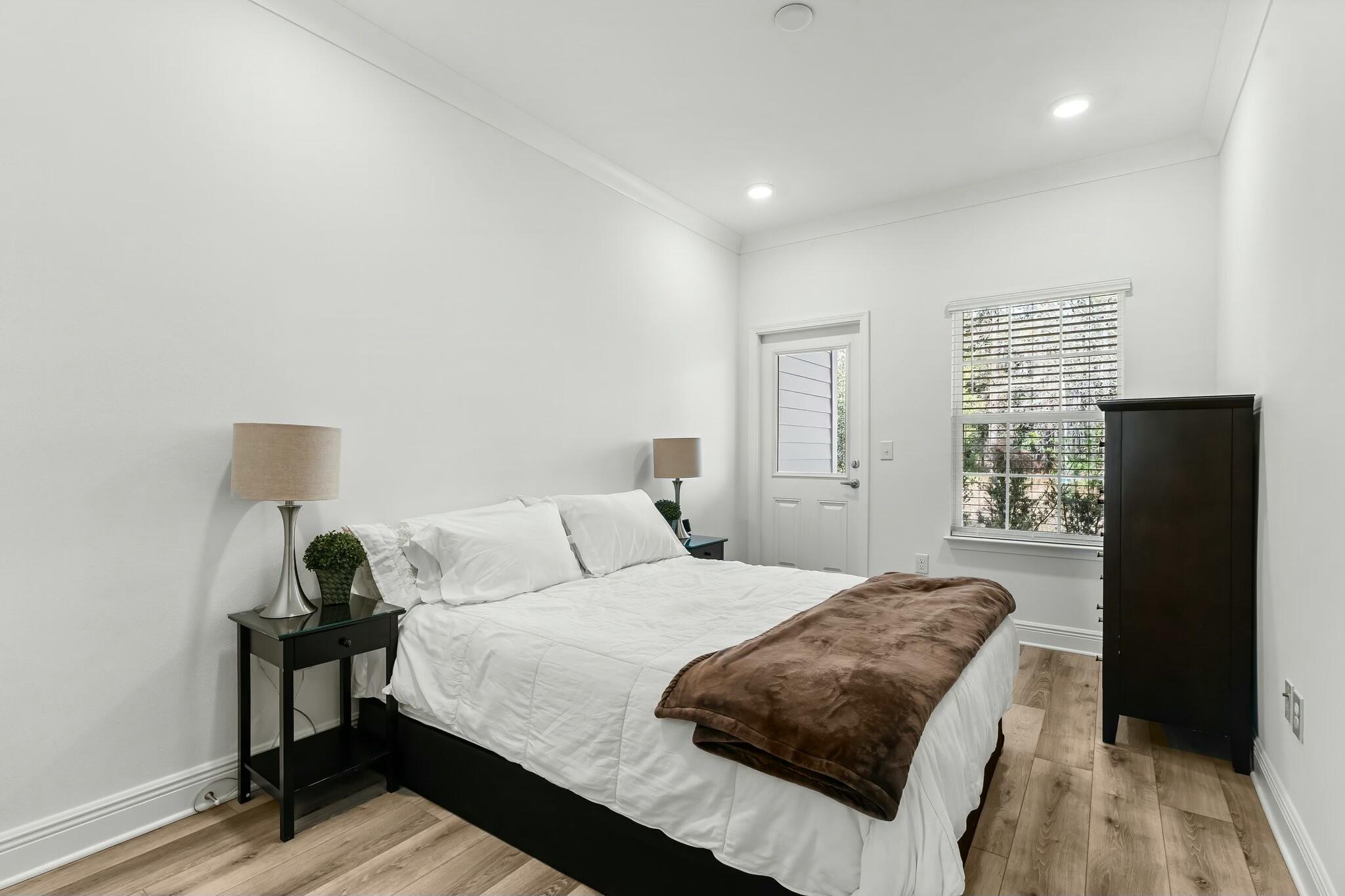 22 Kara Lake Drive Santa Rosa Beach, FL 32459 - Photo 5 of 44 a bedroom with a bed and wooden floor