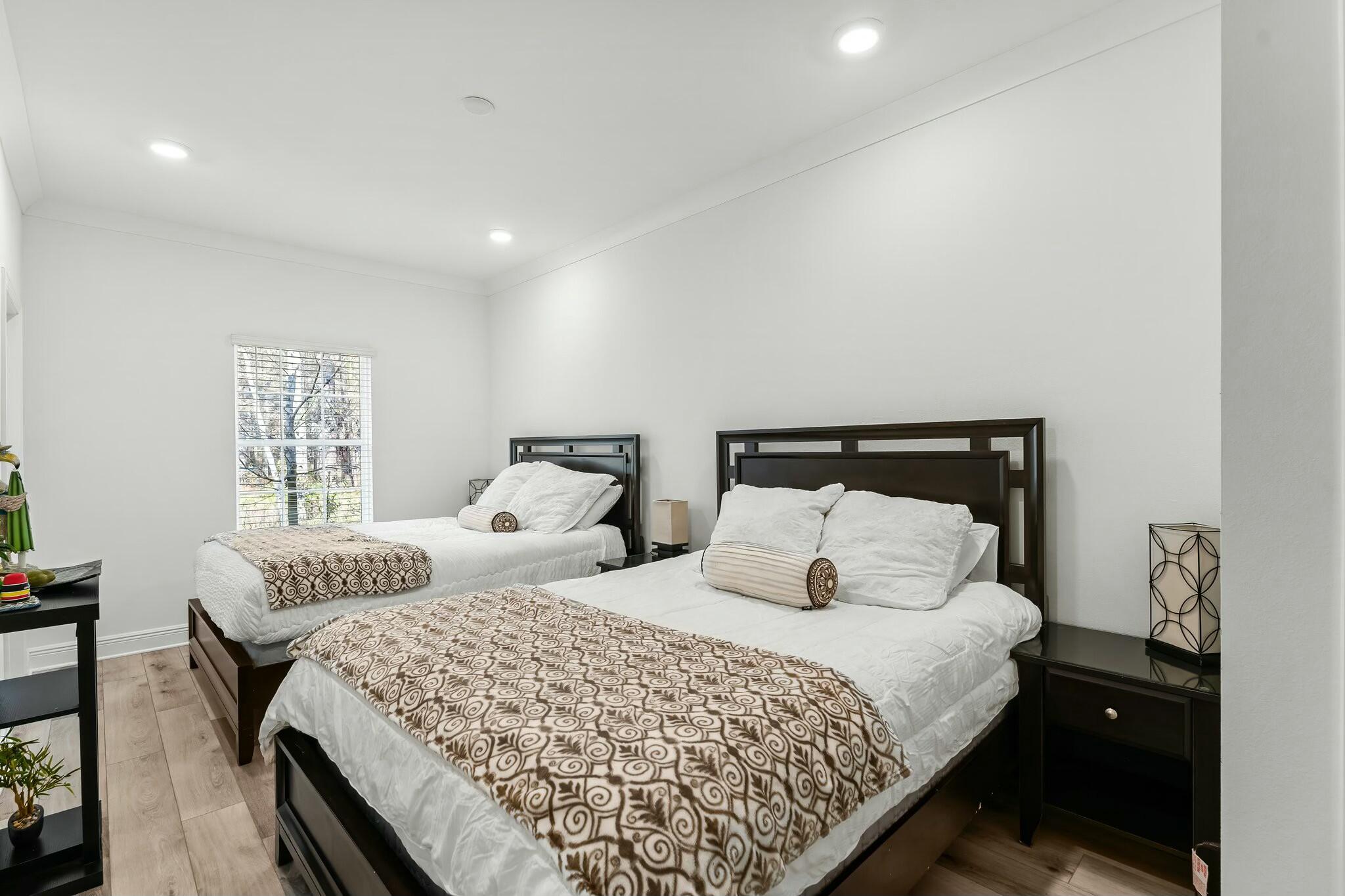 22 Kara Lake Drive Santa Rosa Beach, FL 32459 - Photo 7 of 44 a bedroom with two beds and a lamp