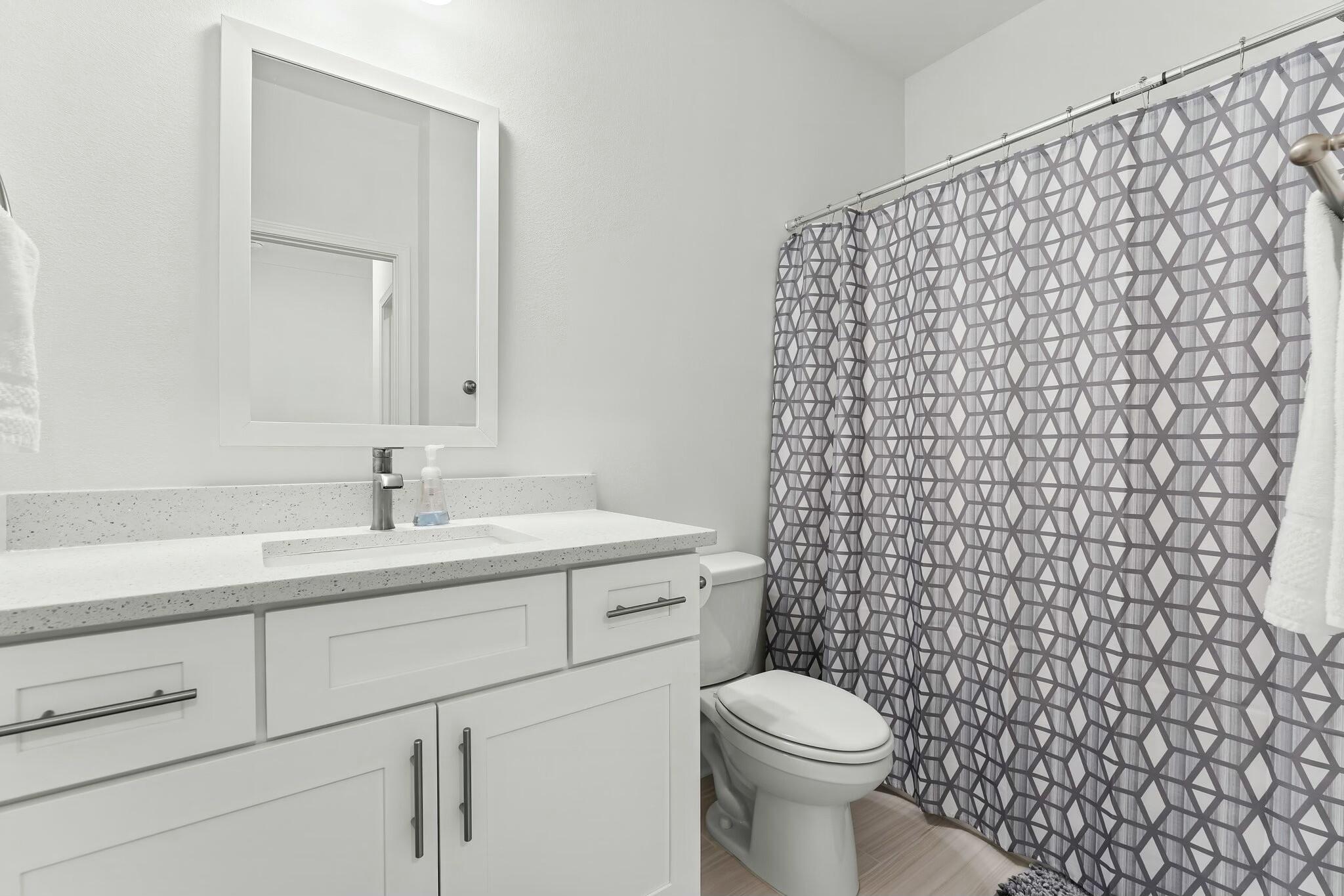 22 Kara Lake Drive Santa Rosa Beach, FL 32459 - Photo 10 of 44 a bathroom with a sink a toilet and a mirror