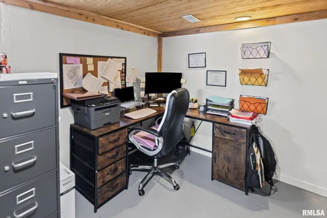a view of a workspace with furniture