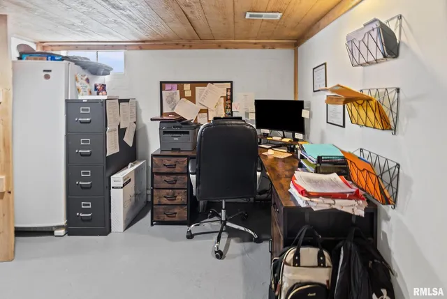 a view of a workspace with furniture