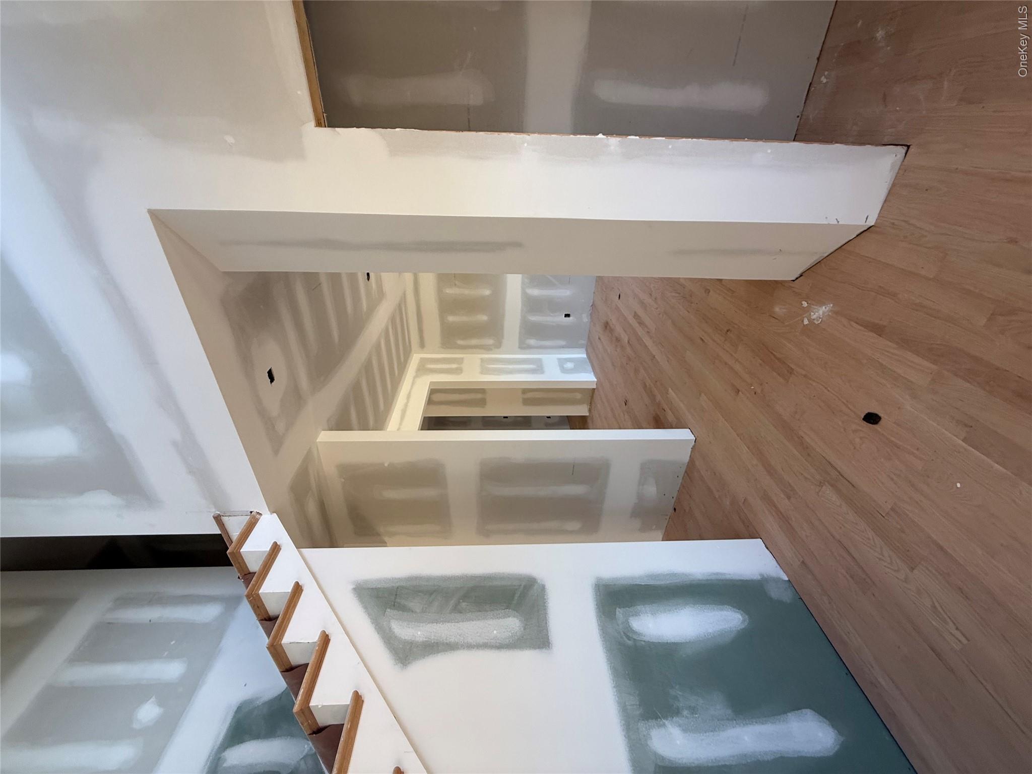 489 Union Corners Road Florida, NY 10921 - Photo 5 of 21 a view of a hallway with wooden floor and a kitchen
