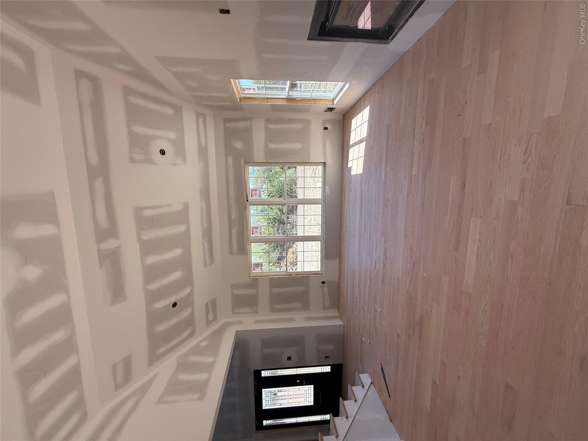 489 Union Corners Road Florida, NY 10921 - Photo 8 of 21 a view of an empty room with a window and fireplace
