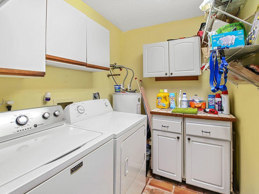 5931 Southeast Pine Drive Stuart, FL 34997 - Photo 17 of 24 a utility room with dryer and washer