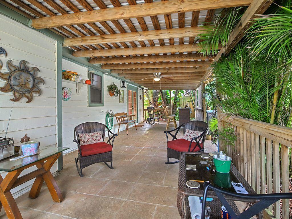 5931 Southeast Pine Drive Stuart, FL 34997 - Photo 18 of 24 a patio with patio table and chairs