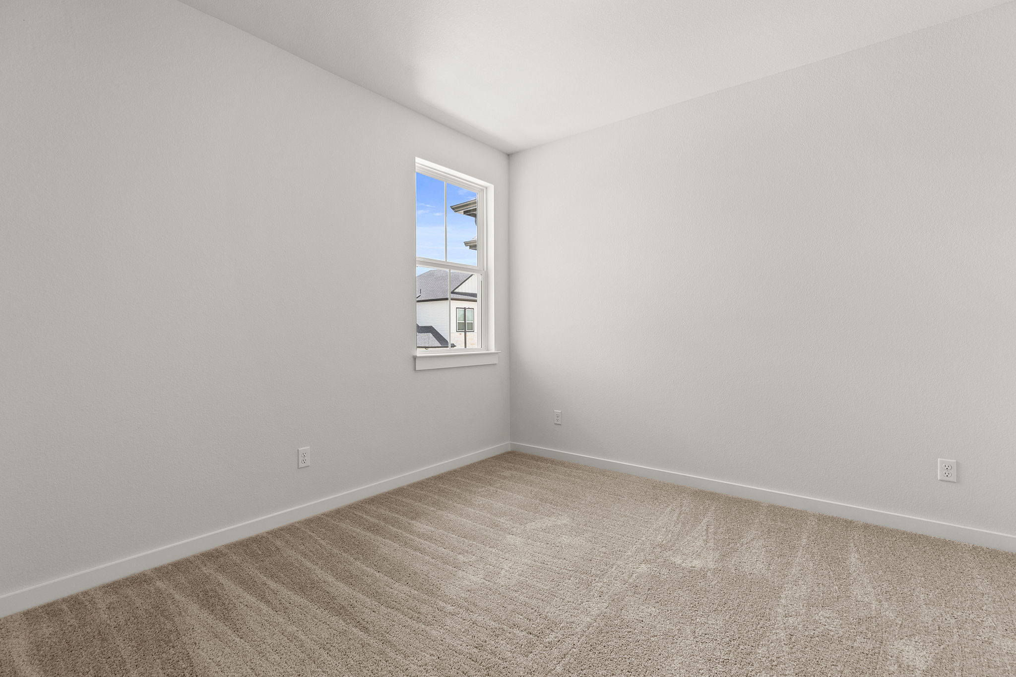 2600 Gattis School Road, Unit 1002 Round Rock, TX 78664 - Photo 24 of 40 A well-proportioned bedroom with fresh carpet and ample natural illumination from the single window.