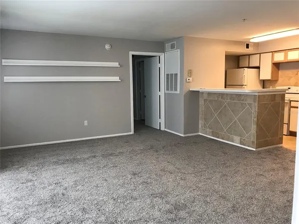 a view of a kitchen with a sink