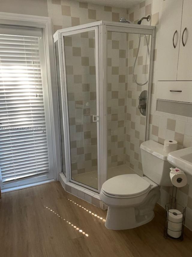 5886 Southwest 42nd Street Miami, FL 33155 - Photo 12 of 20 a bathroom with a toilet and a shower