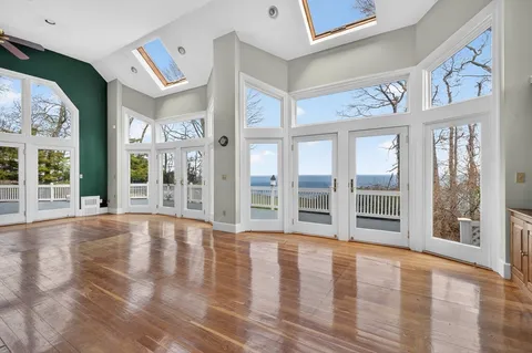 a view of an entryway with wooden floor