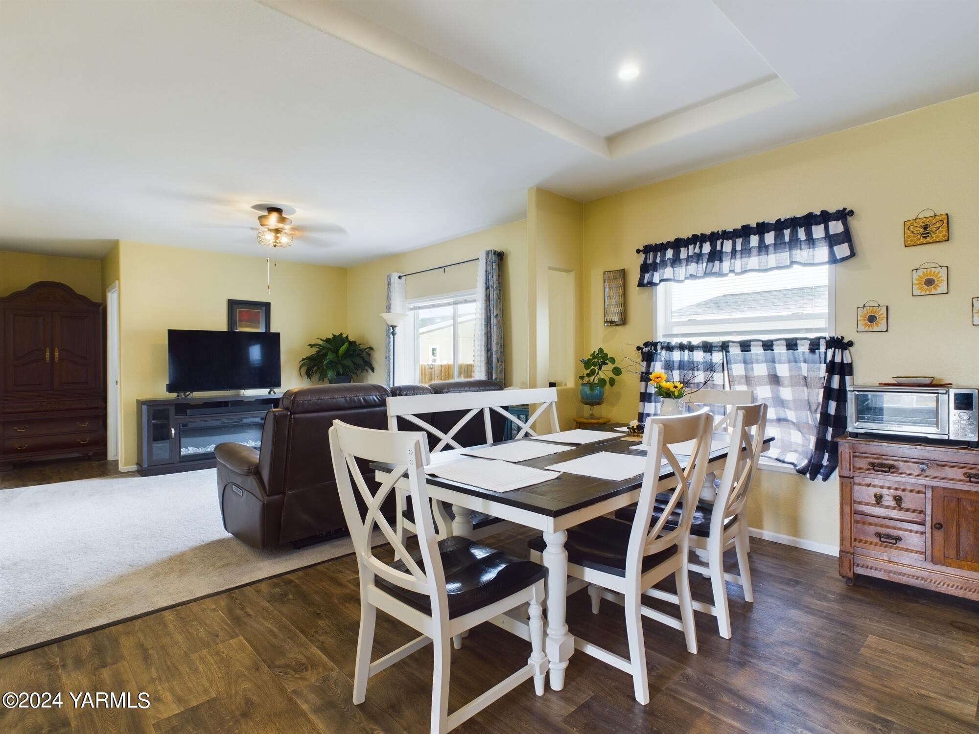 2802 South 5th Avenue, Unit 30 Union Gap, WA 98903 - Photo 15 of 27 a view of a dining room with furniture and wooden floor
