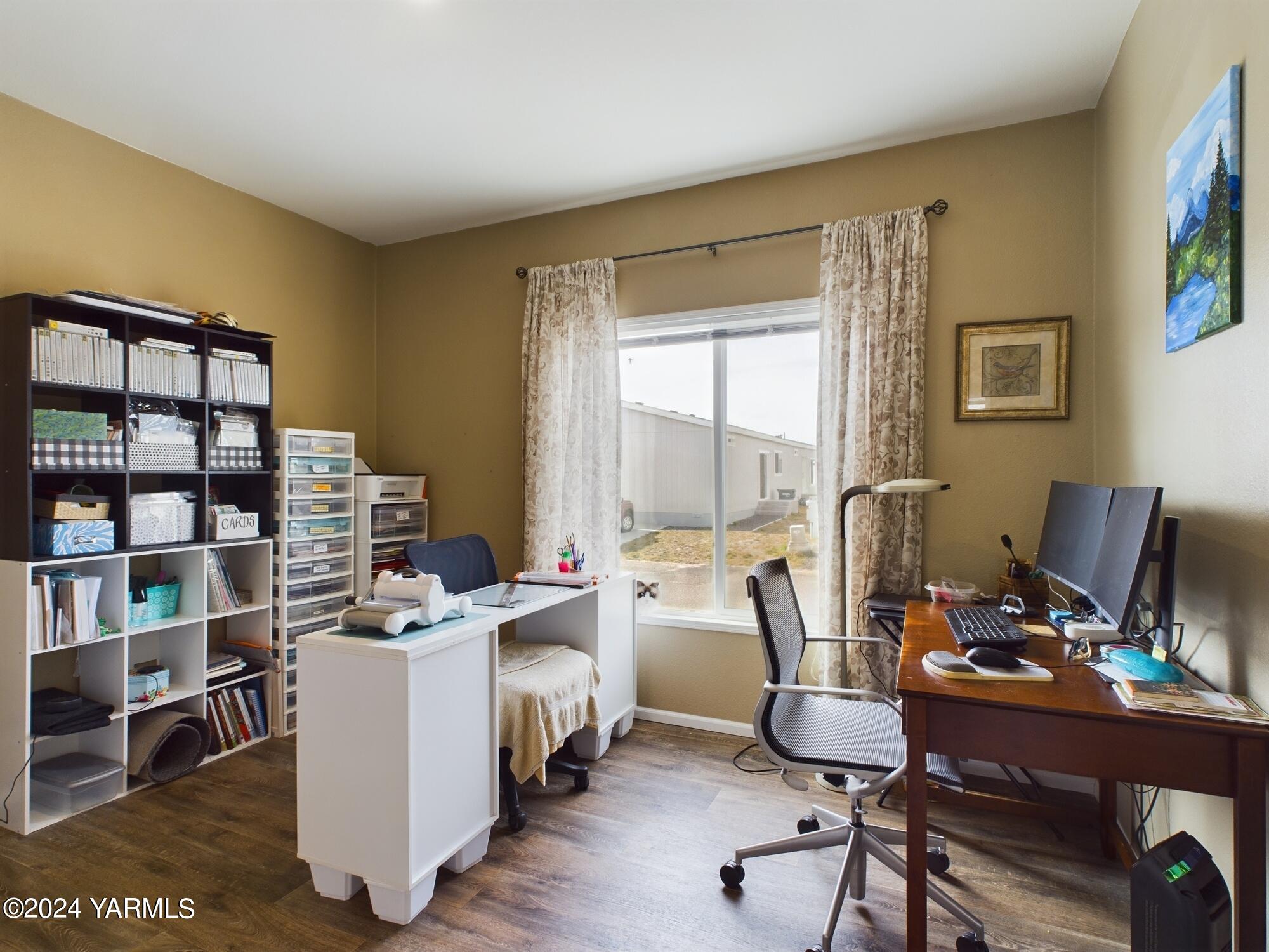 2802 South 5th Avenue, Unit 30 Union Gap, WA 98903 - Photo 19 of 27 a view of a workspace with furniture and a window