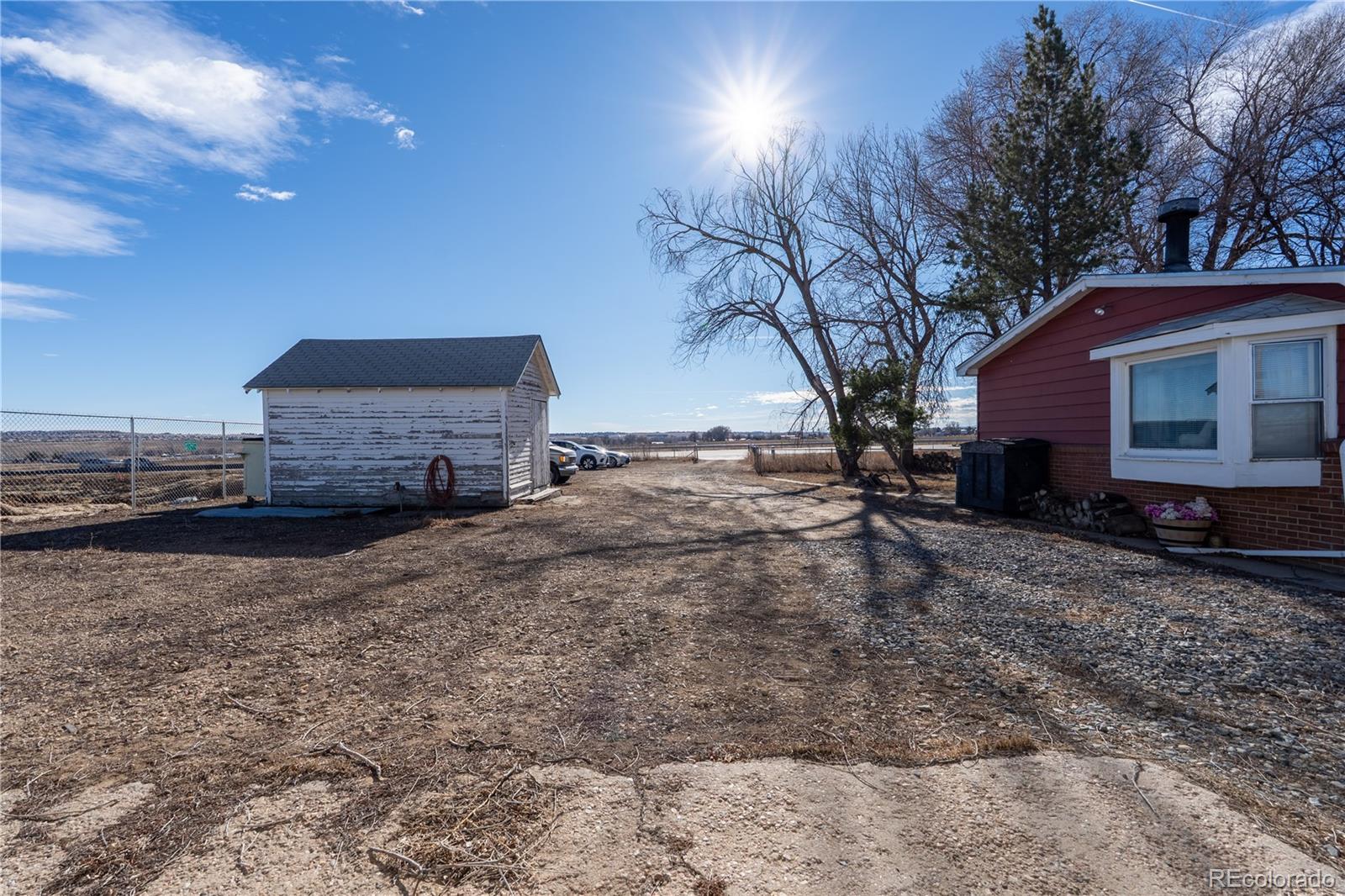 12169 East Baseline Road Lafayette, CO 80026 - Photo 25 of 39 a view of a house with a yard
