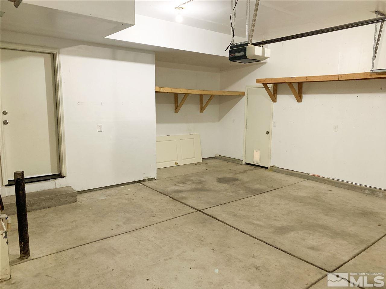 1458 Backer Way Reno, NV 89523 - Photo 8 of 25 a view of a room with a ceiling fan and refrigerator