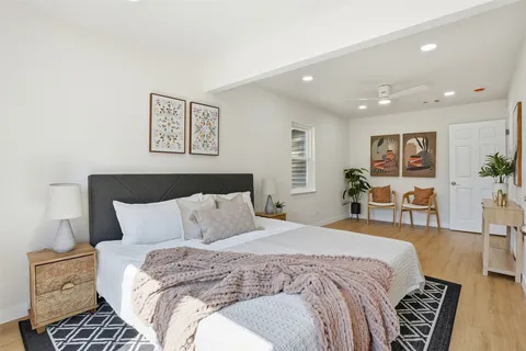 a bedroom with bed and furniture