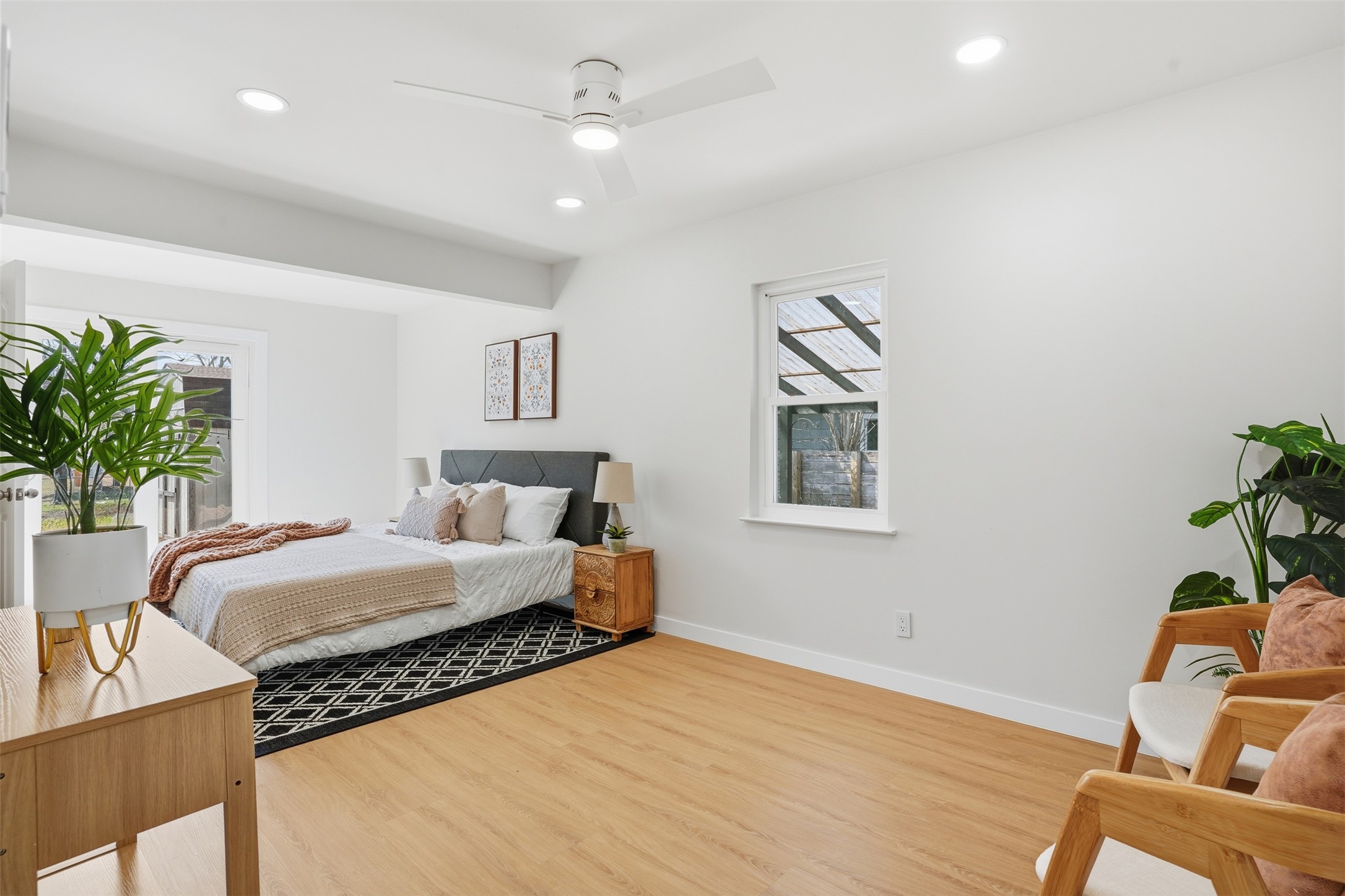 5601 Samuel Huston Avenue Austin, TX 78721 - Photo 20 of 24 Bedroom featuring wood finished floors, recessed lighting, and a ceiling fan